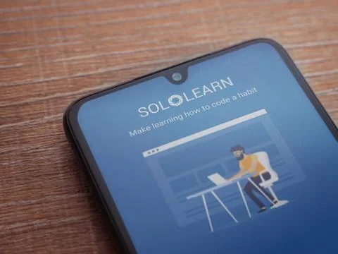 SoloLearn - Learning coding app launch screen with logo on the display of a b Stock Photos