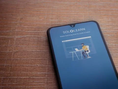 SoloLearn - Learning coding app launch screen with logo on the display of a b Stock Photos