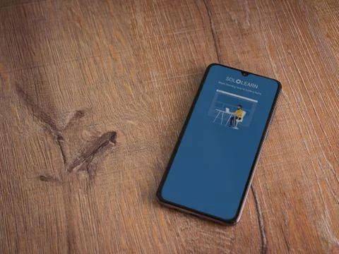 SoloLearn - Learning coding app launch screen with logo on the display of a b Stock Photos