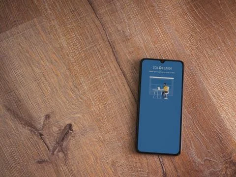 SoloLearn - Learning coding app launch screen with logo on the display of a b Stock Photos