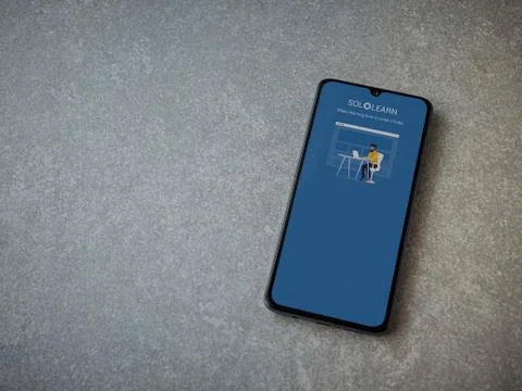 SoloLearn - Learning coding app launch screen with logo on the display of a b Stock Photos