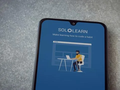 SoloLearn - Learning coding app launch screen with logo on the display of a b Stock Photos