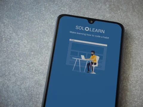 SoloLearn - Learning coding app launch screen with logo on the display of a b Stock Photos