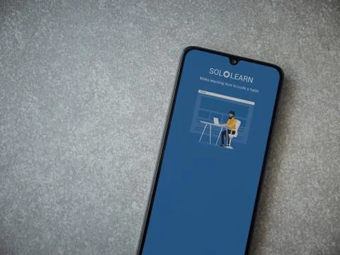 SoloLearn - Learning coding app launch screen with logo on the display of a b Stock Photos