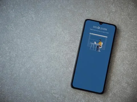 SoloLearn - Learning coding app launch screen with logo on the display of a b Stock Photos