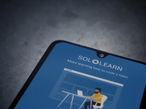 SoloLearn - Learning coding app launch screen with logo on the display of a b Stock Photos