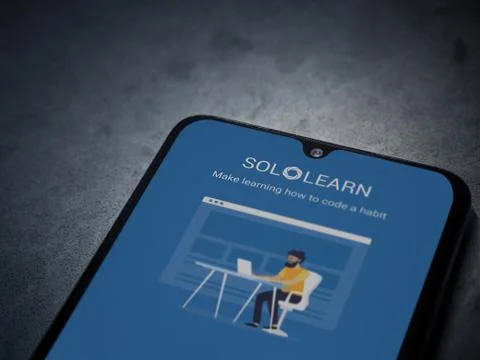 SoloLearn - Learning coding app launch screen with logo on the display of a b Stock Photos