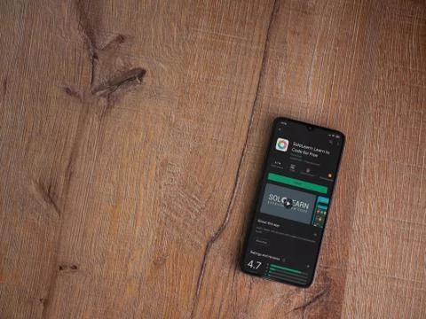 SoloLearn - Learning coding app play store page on the display of a black mob Foto stock