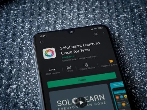 SoloLearn - Learning coding app play store page on the display of a black mob Foto stock