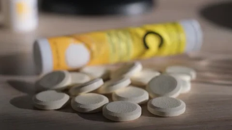 Soluble effervescent tablets of vitamin C lie on the table, close-up Stock-Footage 326652699