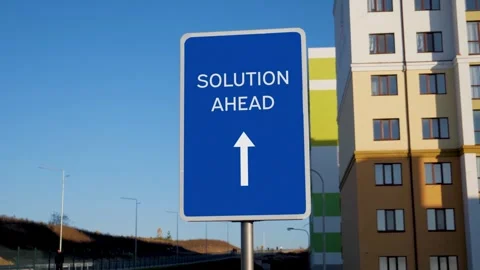 Solution Ahead arrow Road Sign on Clear Blue Sky Stock Footage 272165052