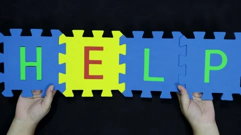 Solution and problem solving foam jigsaw letters help held up in hand Stock Footage 319071014