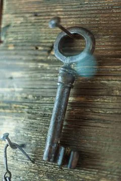 Solution concept image. Key hanging from wall. Key attached to ring hanging o Stock Photos