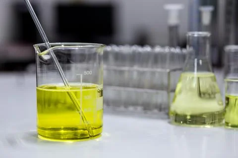 The solution of an emulsifier in a beaker for formulation test of the cosme.. Stock Photos