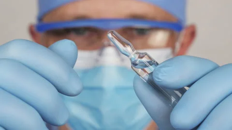 Solution for injection in the ampoule vial in close-up Video stock 135580079