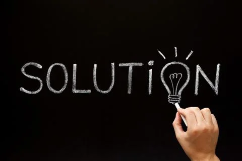 Solution Light Bulb Concept On Blackboard Stockfoto's