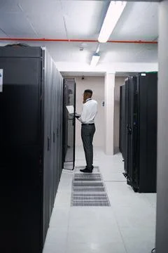 Solution, man or laptop with thinking in server room for console access, po.. Stock Photos