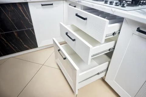 Solution for placing kitchen utensils in modern kitchen - horizontal sliding Stock Photos