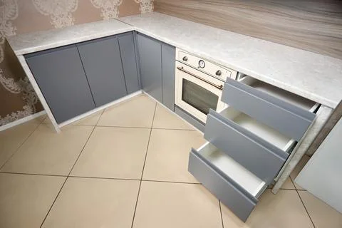 Solution for placing kitchen utensils in modern kitchen. Horizontal sliding Stock Photos