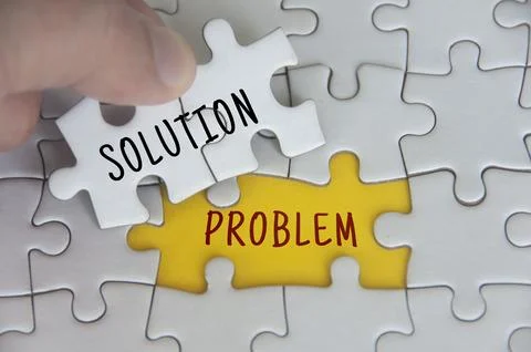 Solution to a problem text on jigsaw puzzle. Problem solving concept Stockfoto's