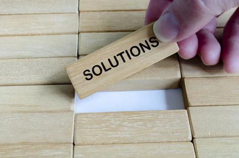 SOLUTION text on wooden blocks with ladder symbolizing problem solving and .. 写真素材