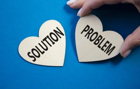 Solution vs Problem symbol. Concept word Solution vs Problem on wooden hear.. 스톡 사진