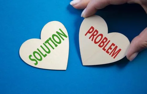 Solution vs Problem symbol. Concept word Solution vs Problem on wooden hear.. 스톡 사진