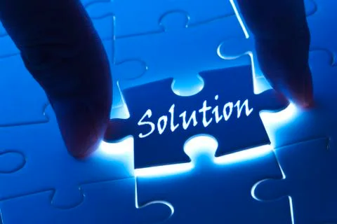 Solution word on puzzle piece 스톡 사진