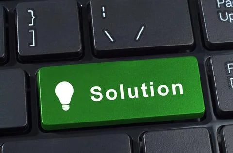 Solutions button computer keyboard with icon lightbulb. Solutions button c... Stock Photos