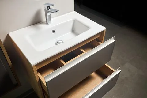 Solutions for placing things in bathroom horizontal sliding pull out drawer Stock Photos