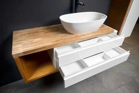 Solutions for placing things in bathroom horizontal sliding pull out drawer Stock Photos