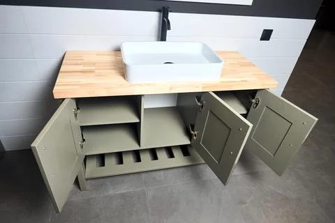 Solutions for placing things in bathroom opened locker drawers with doors she Stock Photos