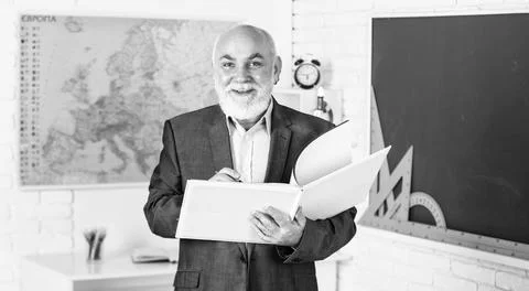 Solve complex problem. teacher of geography. classroom with map and blackboard Stock Photos