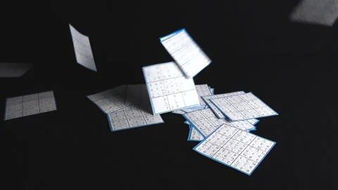 Solved paper sudoku puzzles falling on a black background Stock Footage 340148309