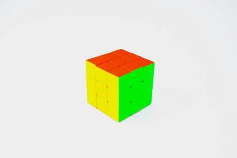 A solved Rubik cube isolated in a white background,displaying red green and y Stock Photos