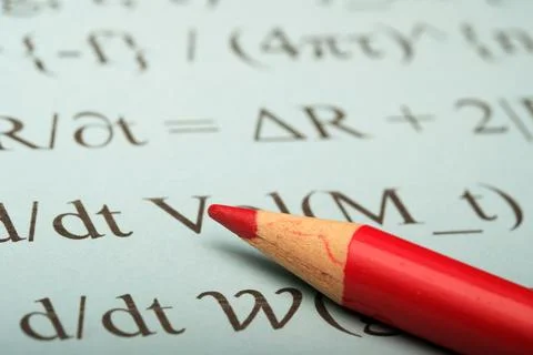 Solving equations with a red pencil Stock Photos