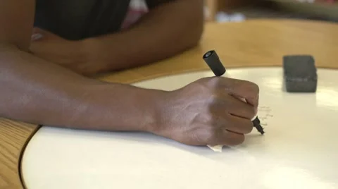 Solving math problem on dry erase table Stock Footage 8511156