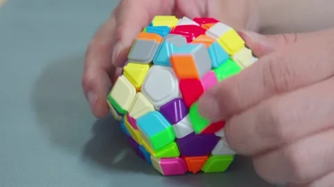 Solving Megaminx Dodecahedron Puzzle Close Up 4K Video stock 339124086