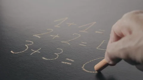 Solving primary school math exercises Stock Footage 339725265