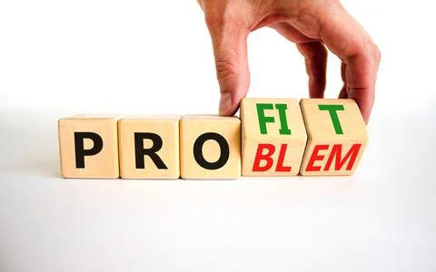 Solving a problem and making profit symbol. Businessman turns wooden cubes, c Foto stock