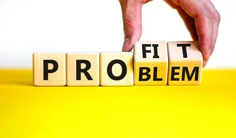 Solving a problem and making profit symbol. Businessman turns wooden cubes, c Foto stock