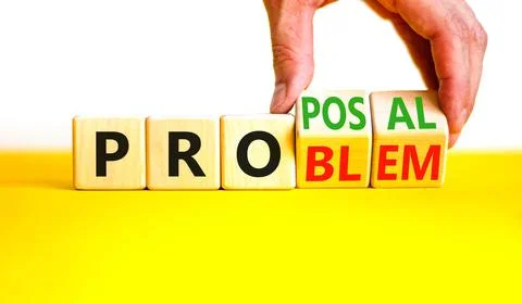 Solving a problem and making proposal symbol. Businessman turns wooden cubes  Stock Photos