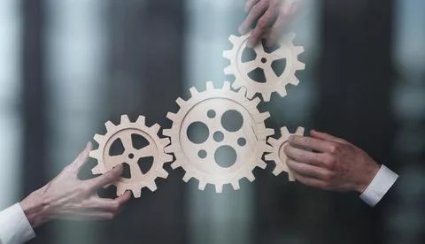 Solving the problem concept - puzzles and cogwheels. Stock Photos