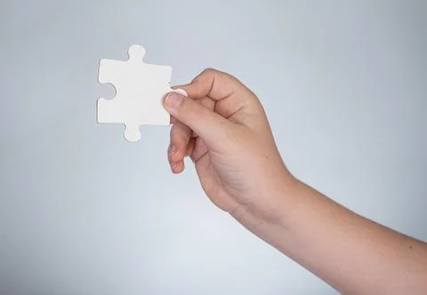 Solving problem starts with single puzzle. Solving concept shows logical Stock Photos