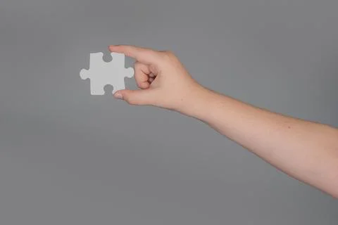 Solving problem starts with single puzzle. Solving concept shows logical Stock Photos