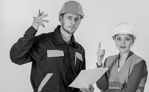 Solving problems concept. Man and woman in hard hats, 写真素材