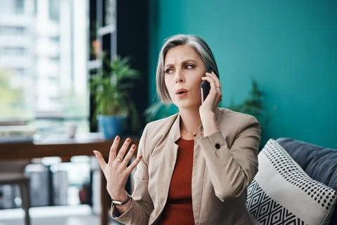 Solving problems is my speciality. an attractive mature businesswoman sitting Foto stock