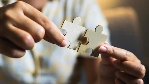 Solving puzzle engaging activity home cozy environment close-up creativity Stock Photos