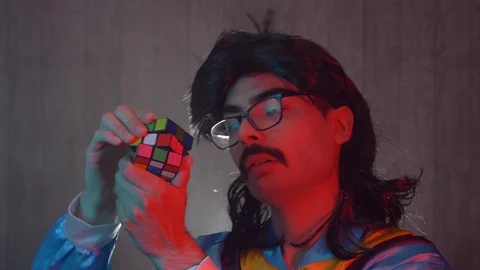 Solving a Rubik Cube in the 11980 1990 Stock Footage 114252880