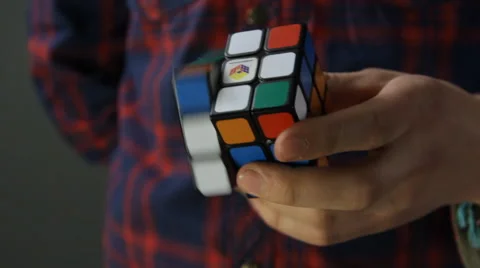 Solving Rubik's Cube puzzle with One Hand Stock Footage 49931282